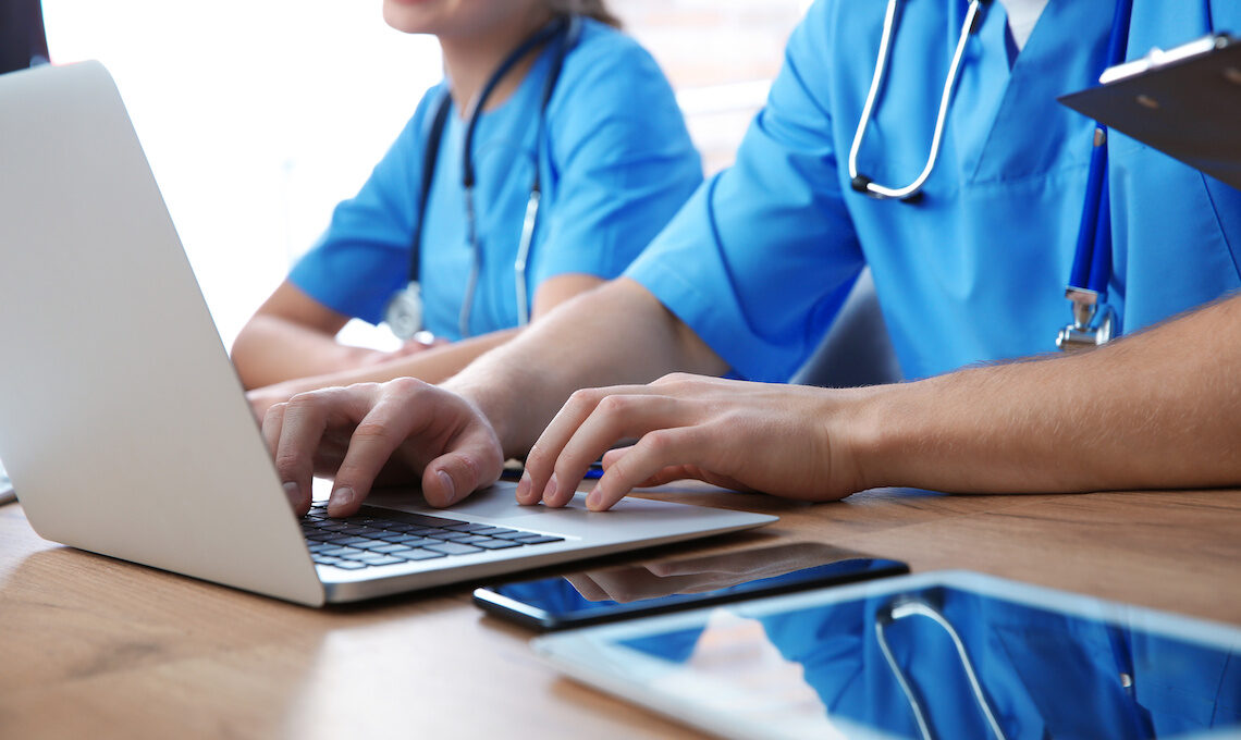 Medical students studying using devices